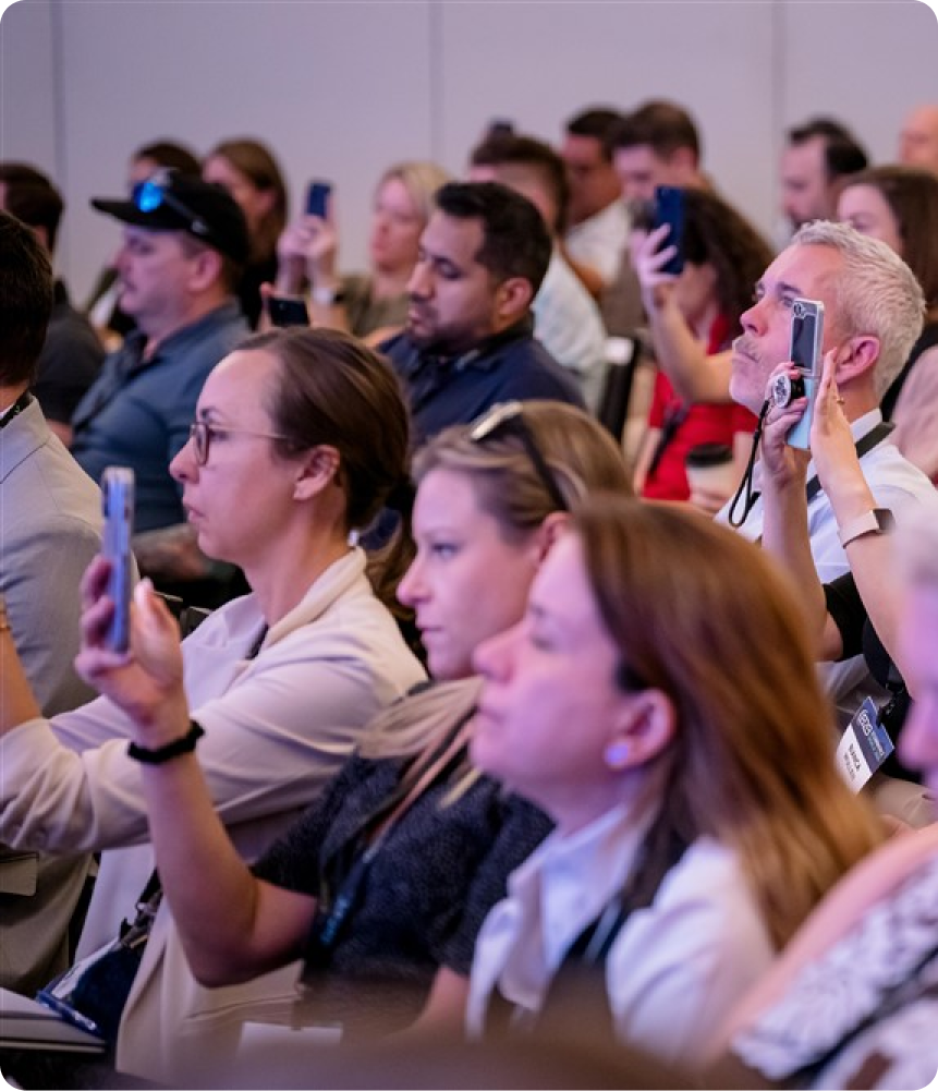 Engaged B2B leaders attending a live session at the summit